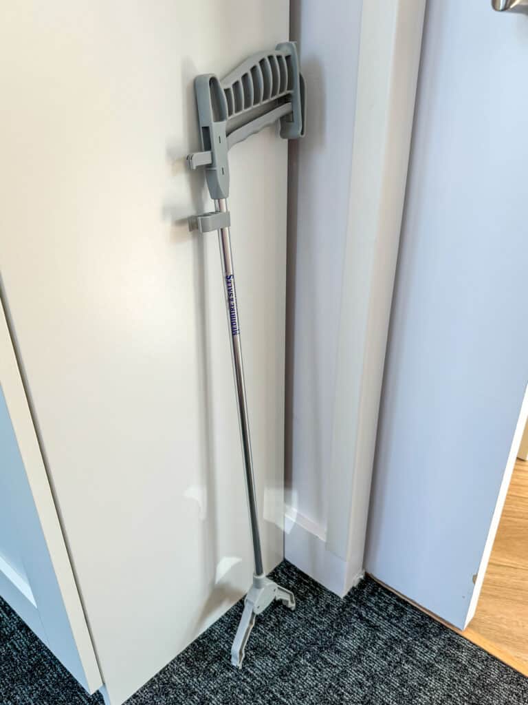 Amy's gray grabber standing up in the corner of a room