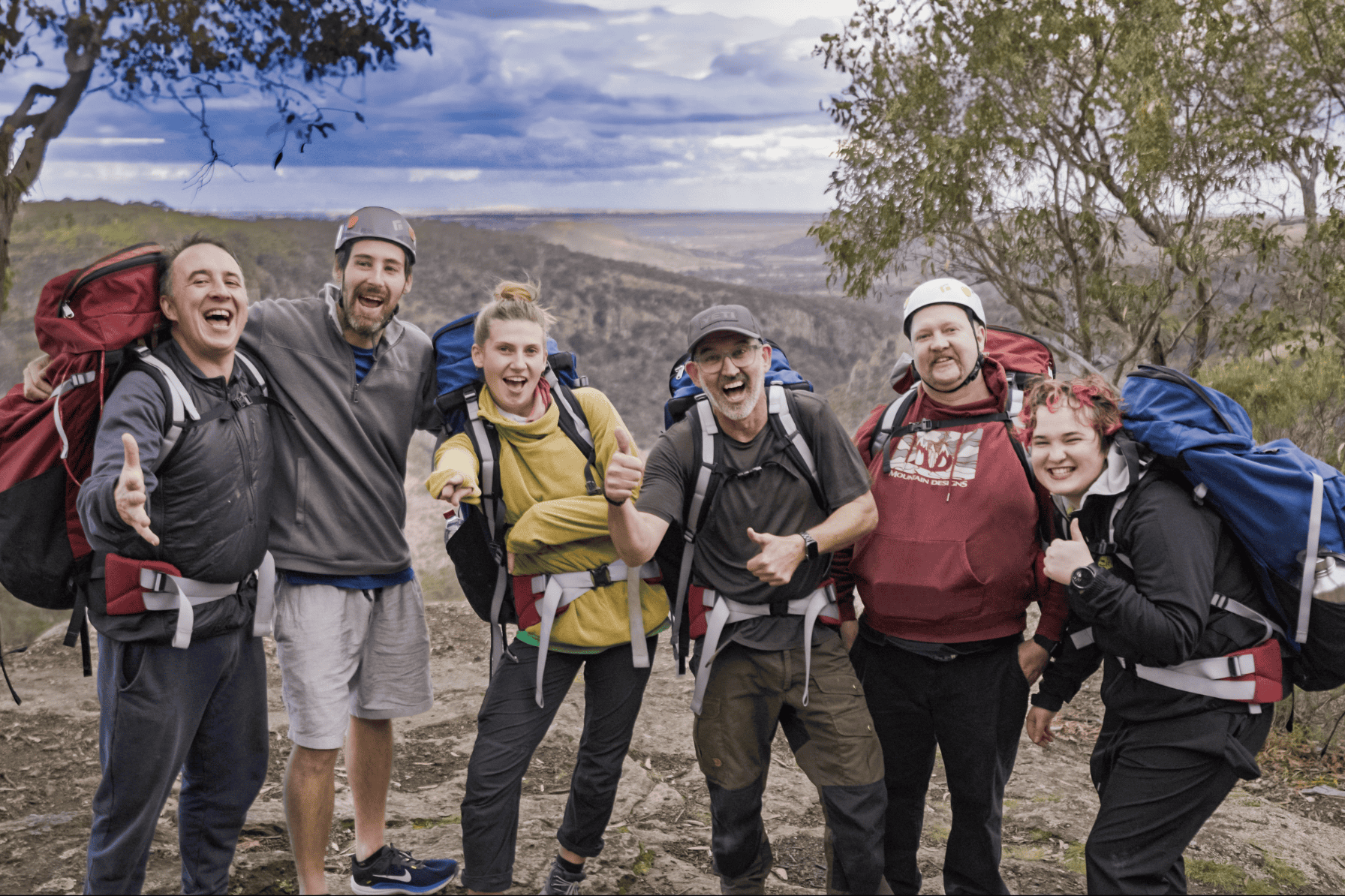 A group of six men and women at ODI's rock climbing activity