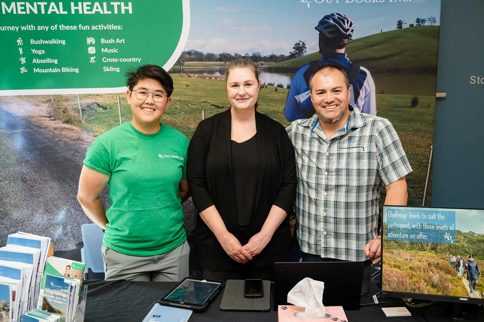 Three people at the ADS wyndham disability expo in 2024