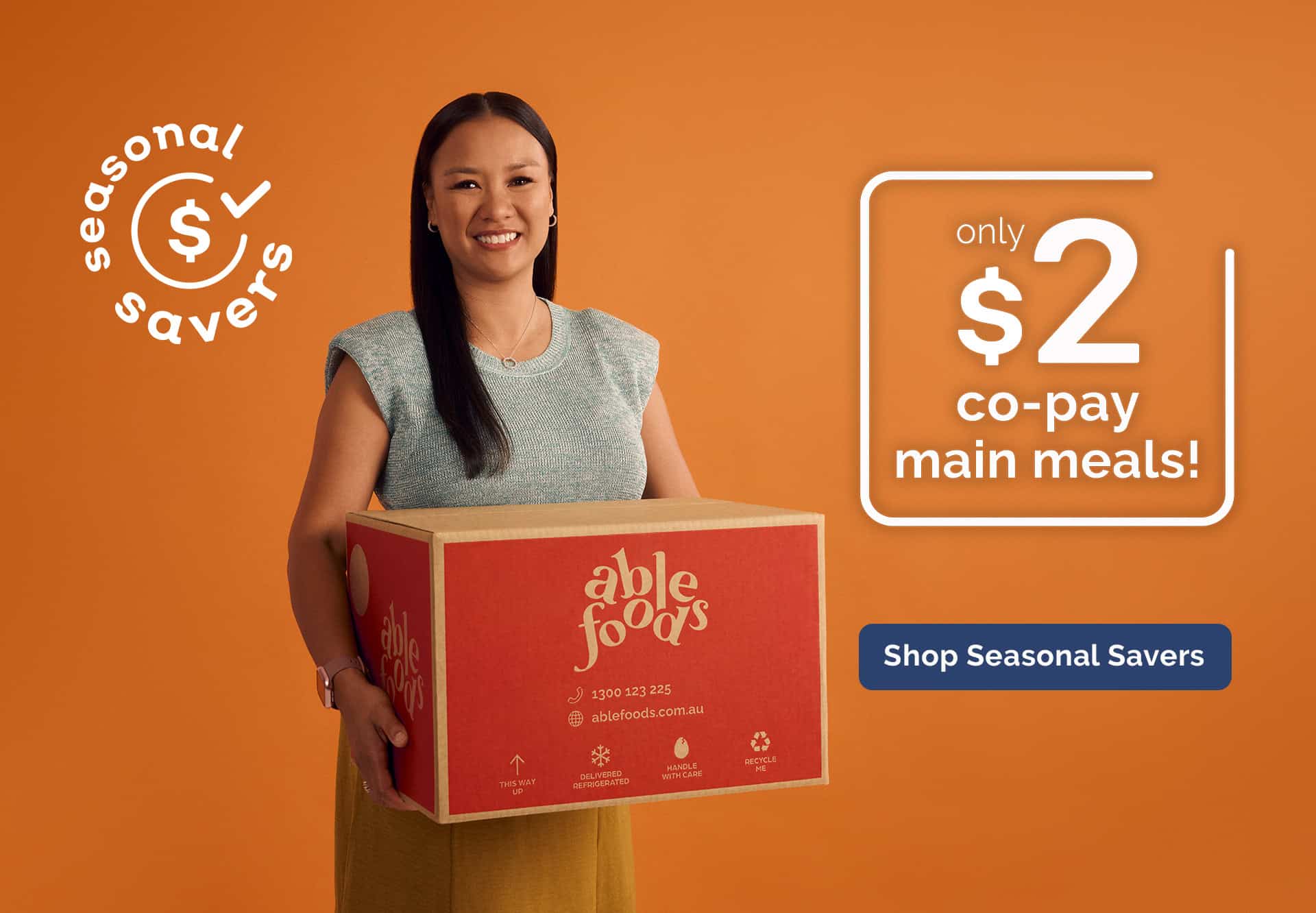 Woman holding Able Foods box for Seasonal Savers range